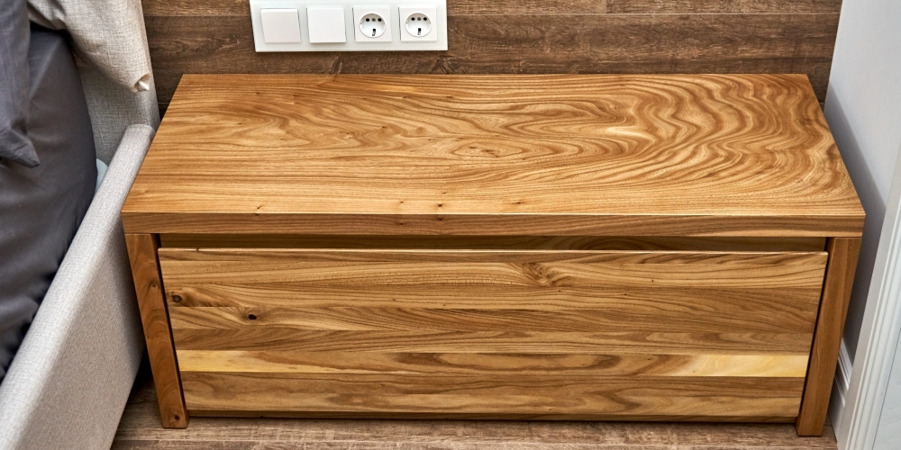 Solid wood nightstand in the interior. Solid elm nightstand. Details furniture